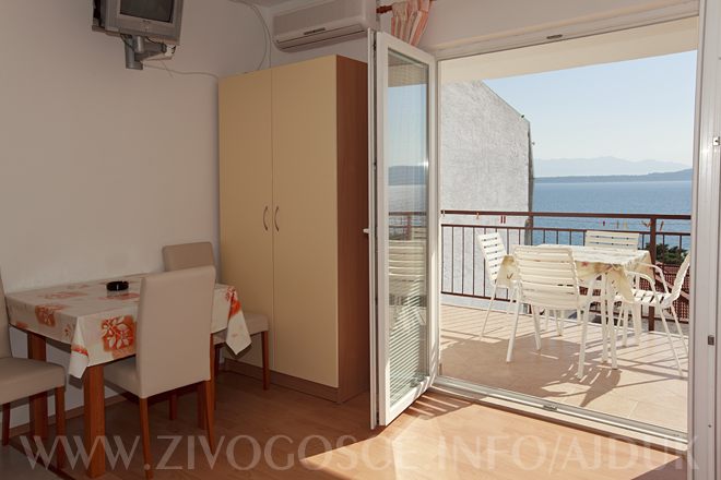 dinning table with balcony with sea view